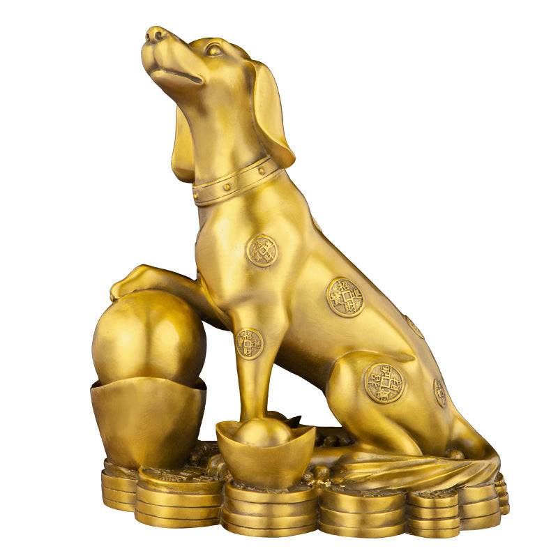 Antique bronze guardian dog statue on wooden desk with gold collar detailing