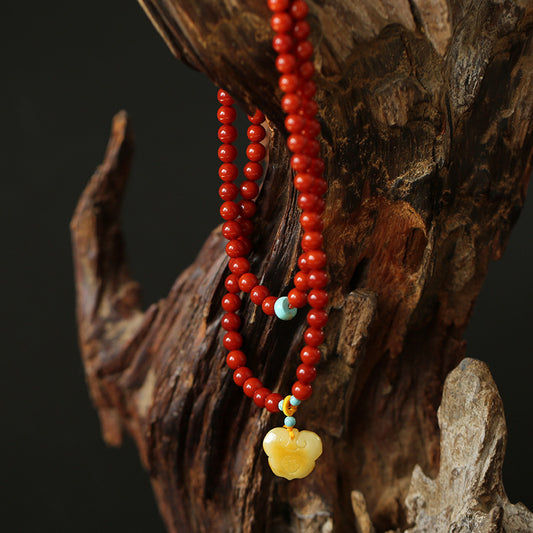 Nan Hong Agate Fire Energy Bracelet with Tengshe Motif for  Success
Nine Purple Fire Jewelry with Baltic Amber and Ruyi Charm