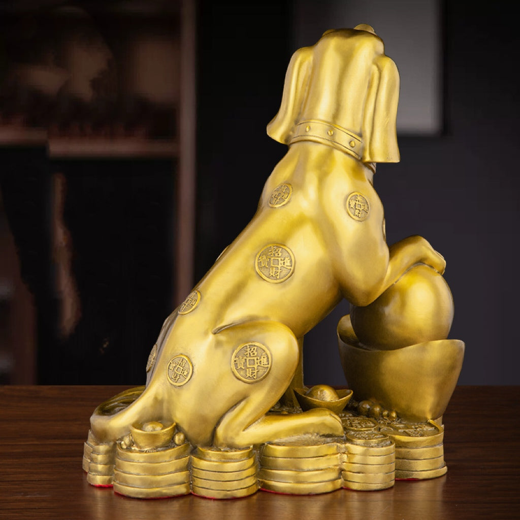 Antique bronze guardian dog statue on wooden desk with gold collar detailing